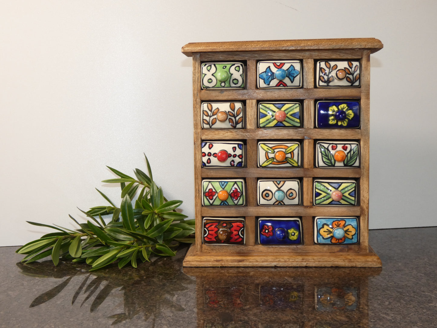 Wooden chest with 15 ceramic drawers