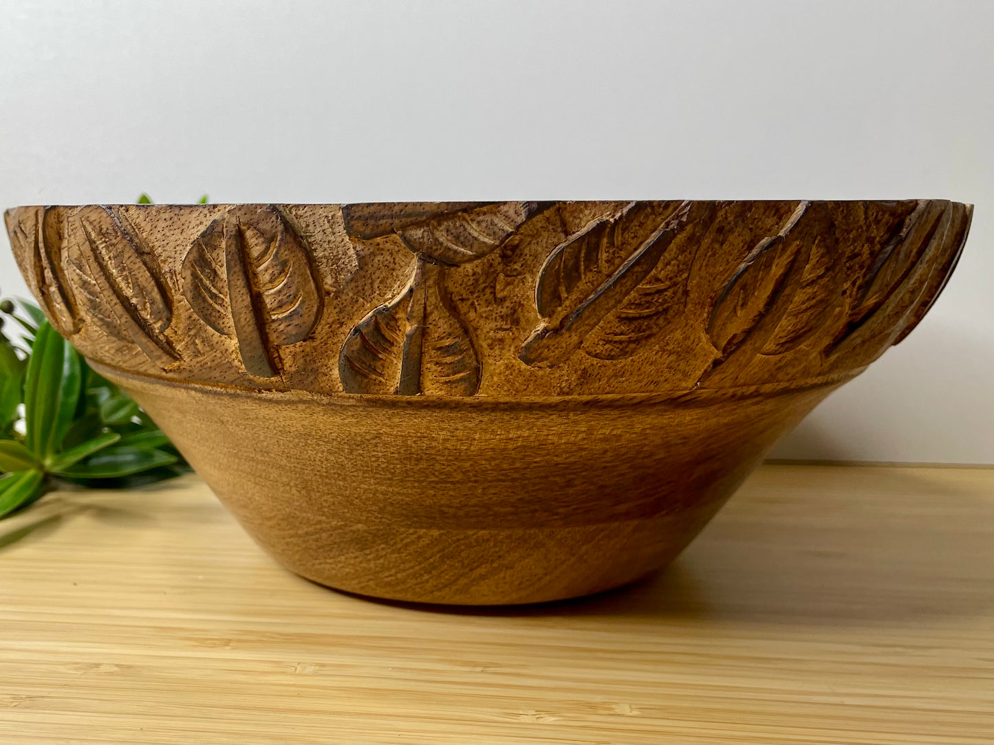 Natural Mango Wood Fruit Bowl with carved leaf detail.
