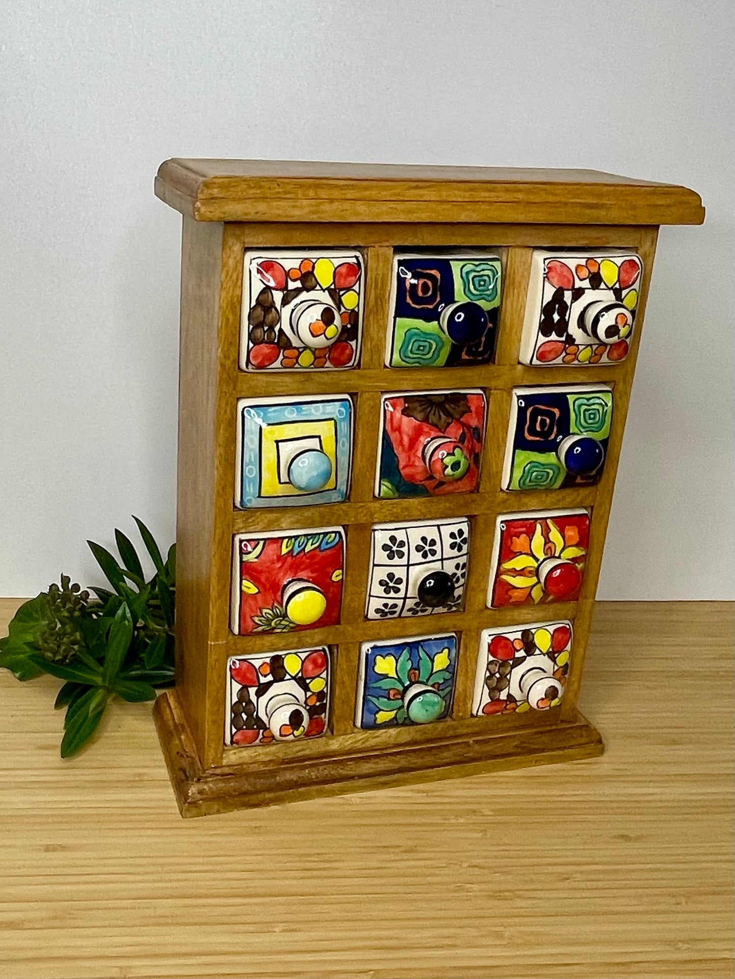 Large wooden chest of 12 ceramic drawers