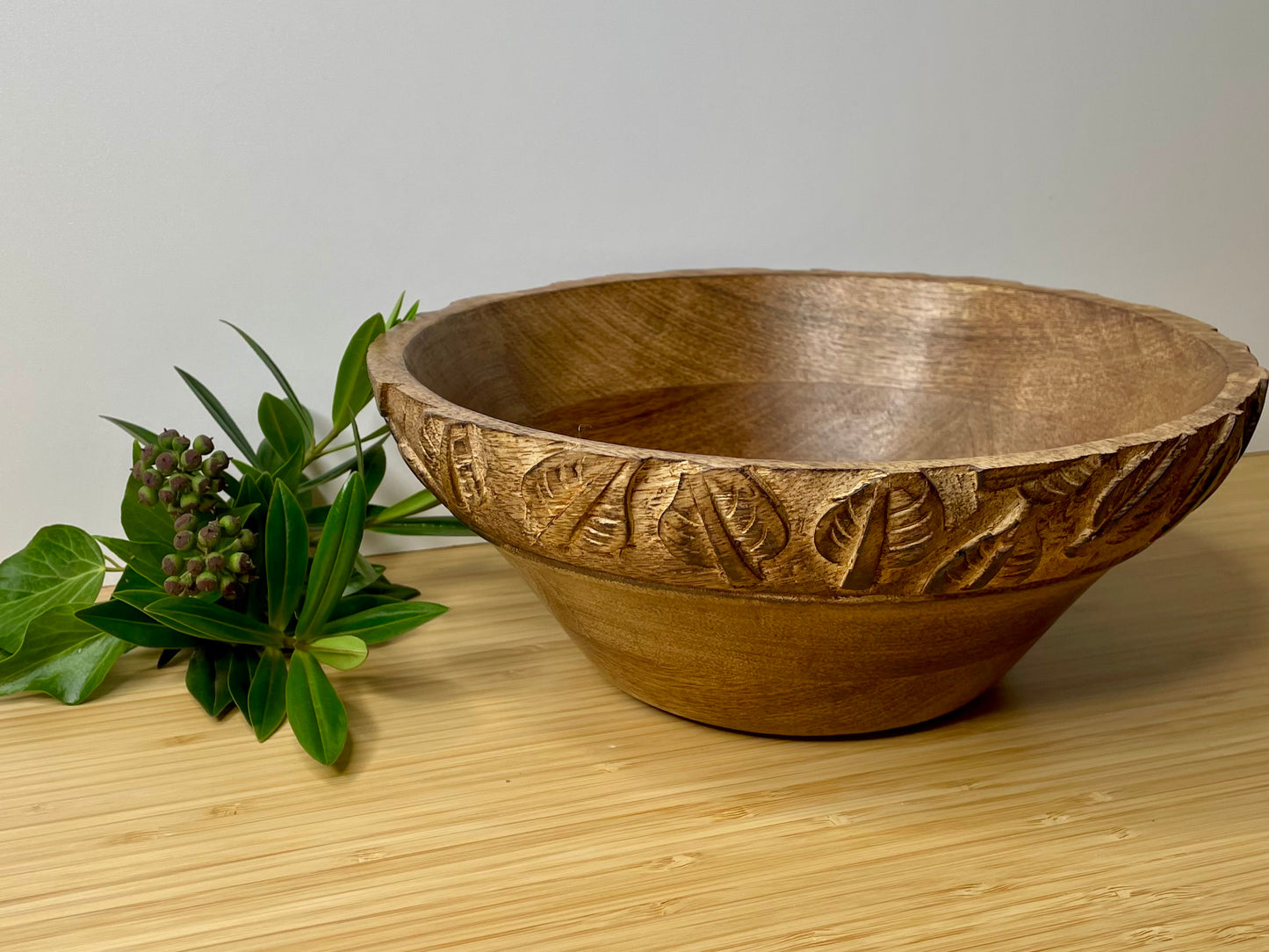 Natural Mango Wood Fruit Bowl with carved leaf detail.