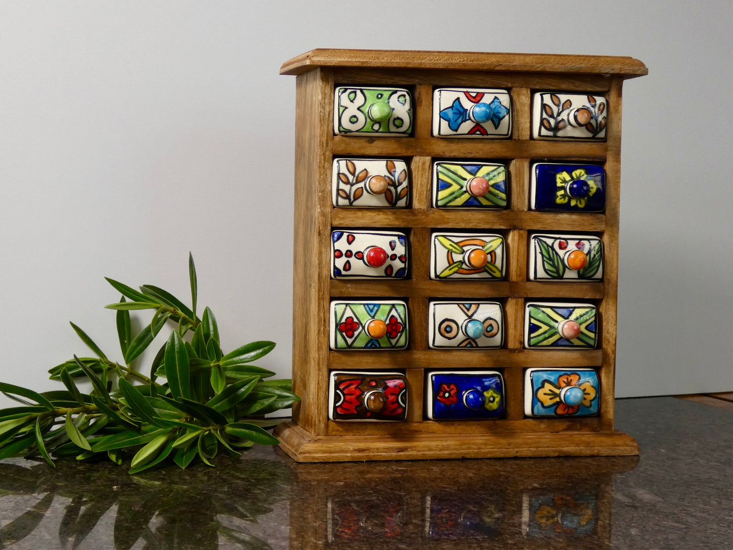 Wooden chest with 15 ceramic drawers
