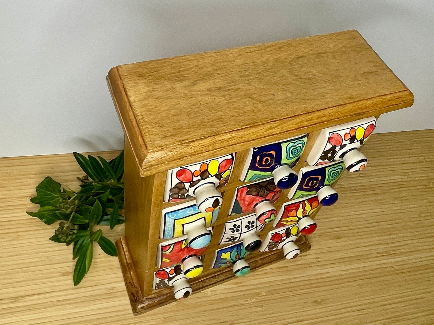 Large wooden chest of 12 ceramic drawers