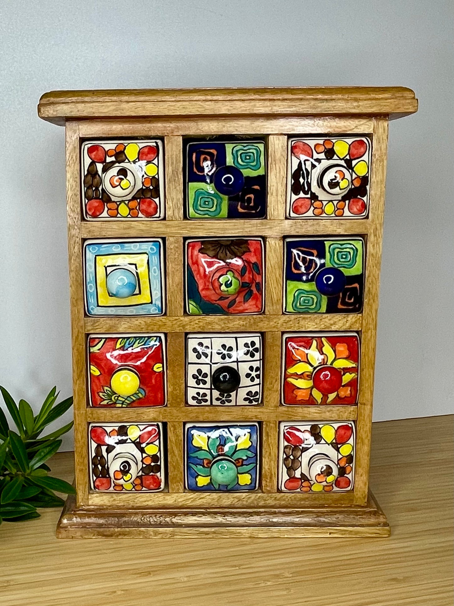 Large wooden chest of 12 ceramic drawers