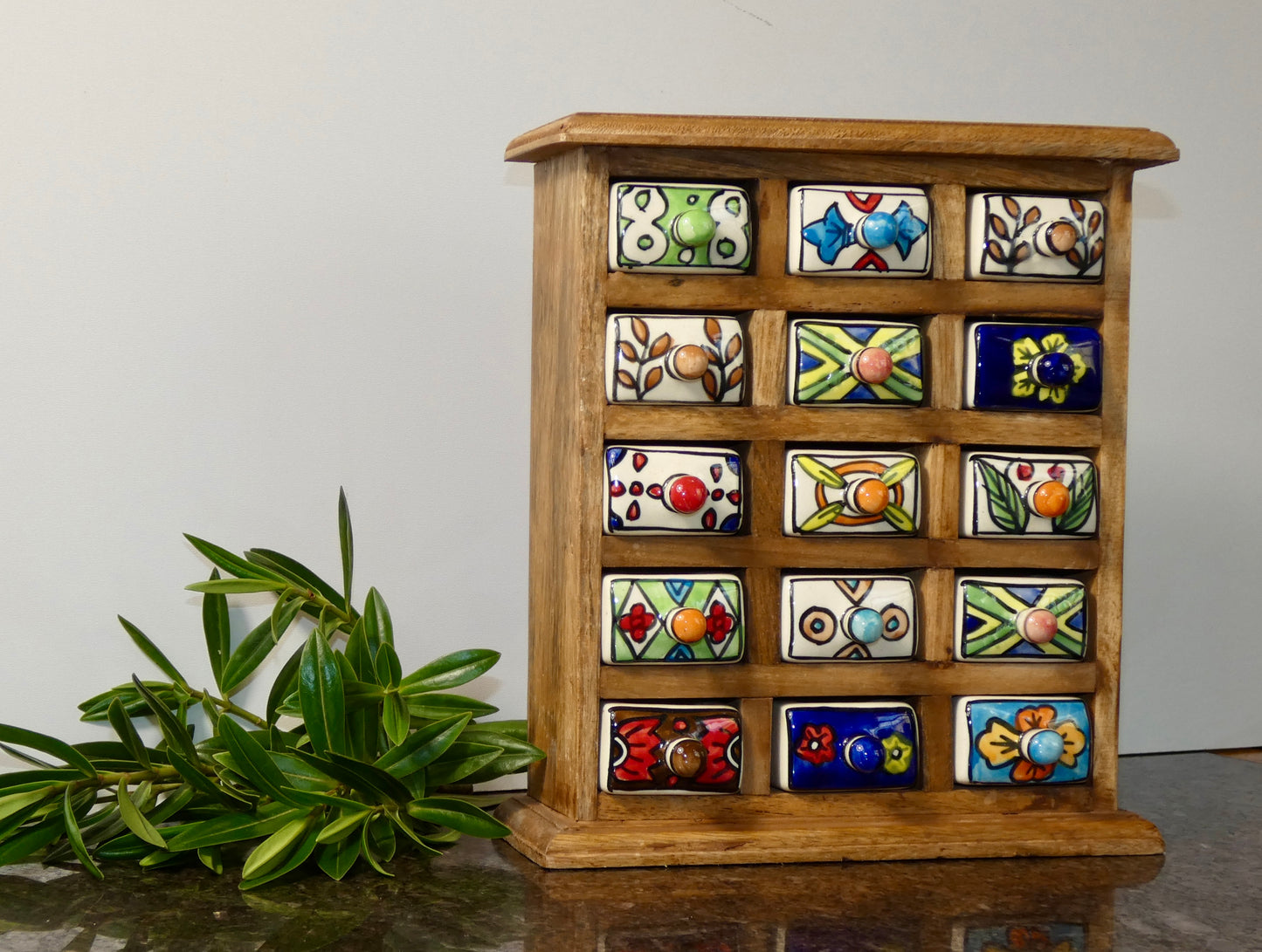 Wooden chest with 15 ceramic drawers