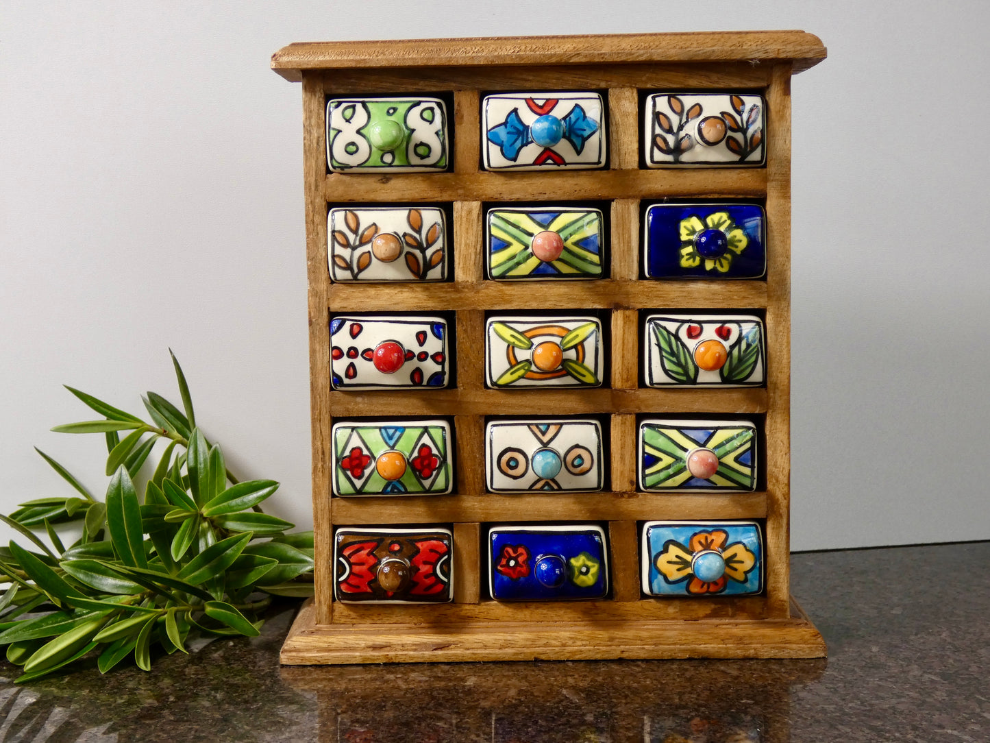 Wooden chest with 15 ceramic drawers
