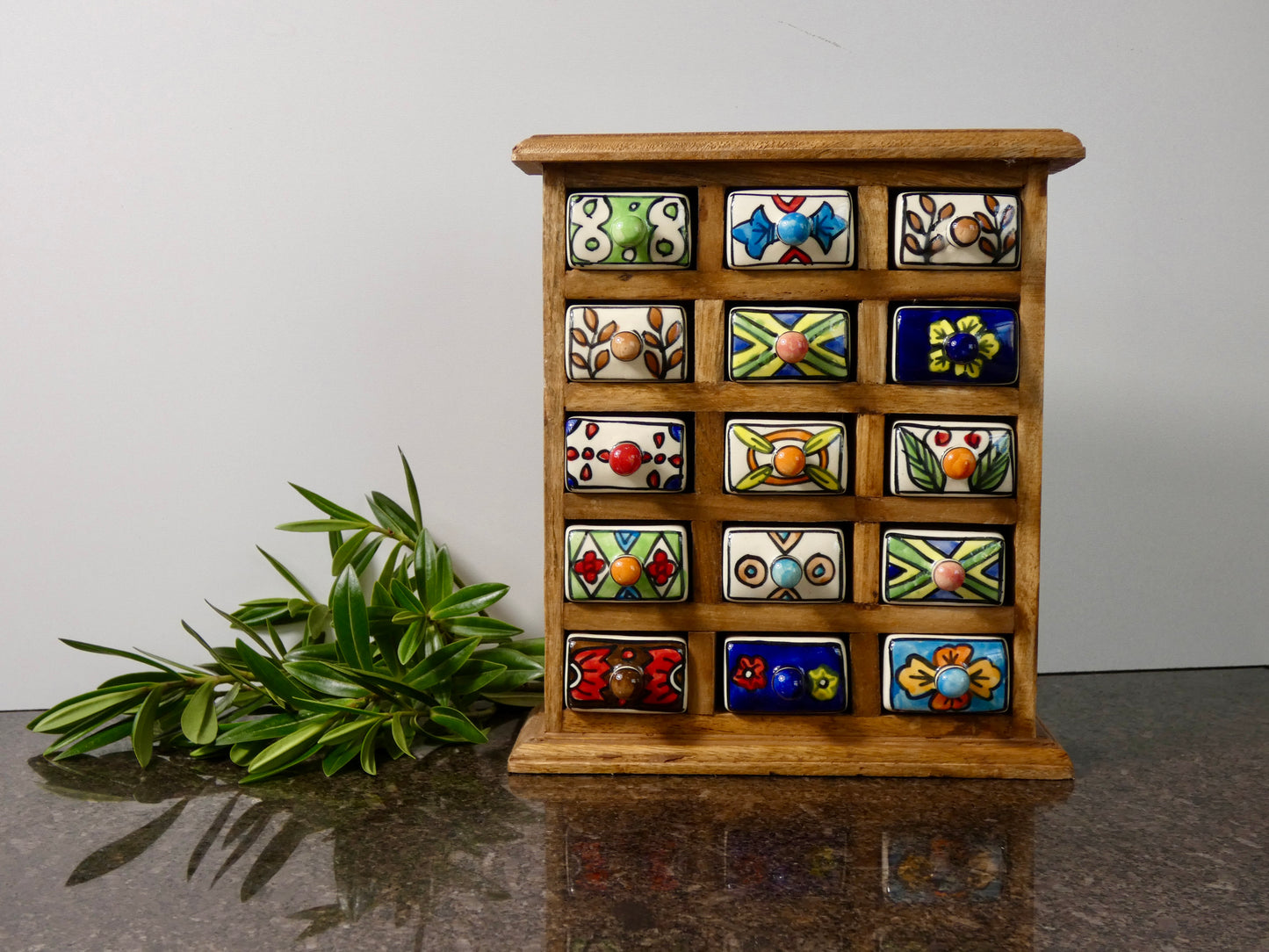 Wooden chest with 15 ceramic drawers