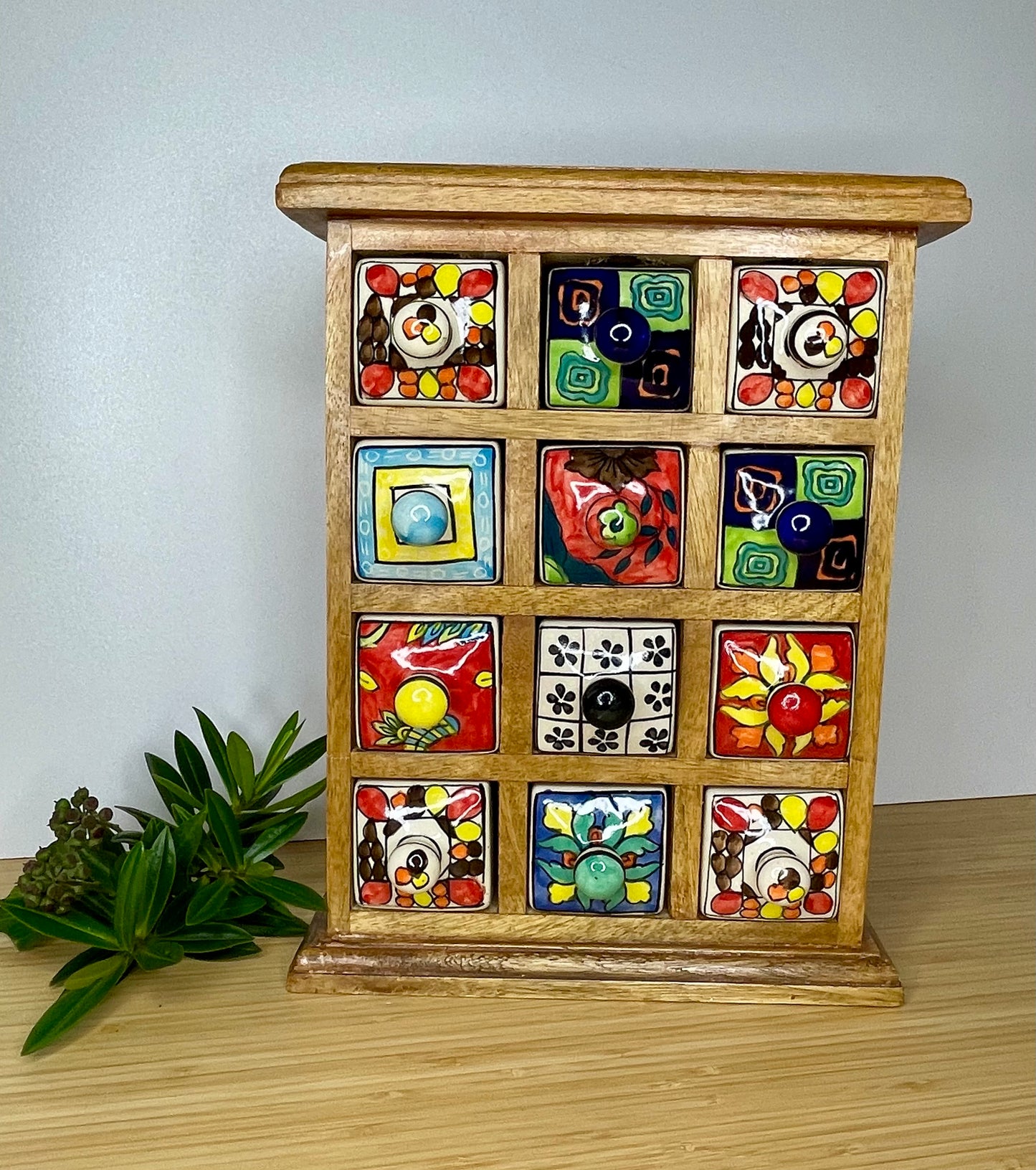 Large wooden chest of 12 ceramic drawers