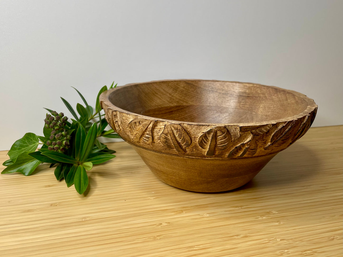 Natural Mango Wood Fruit Bowl with carved leaf detail.