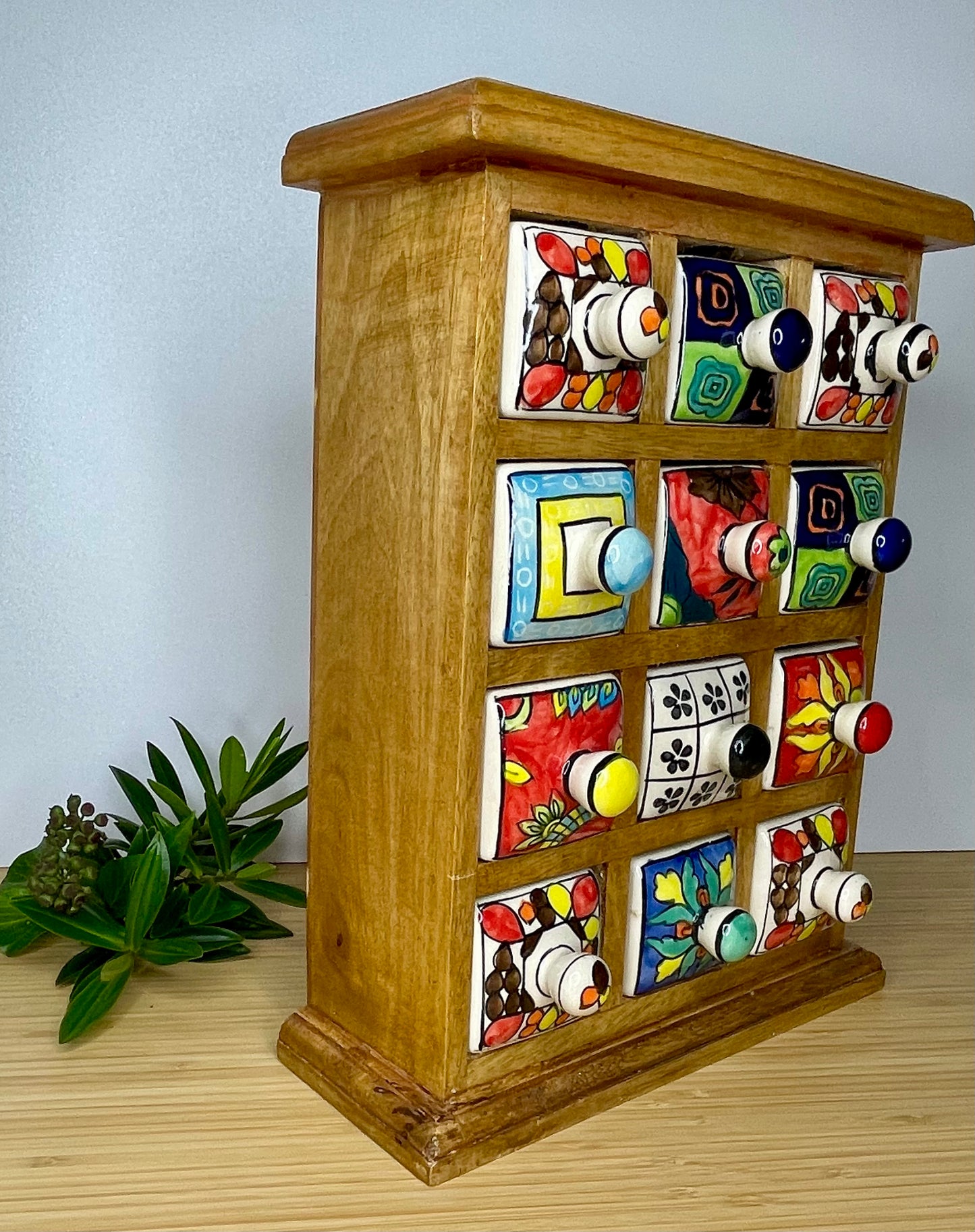 Large wooden chest of 12 ceramic drawers