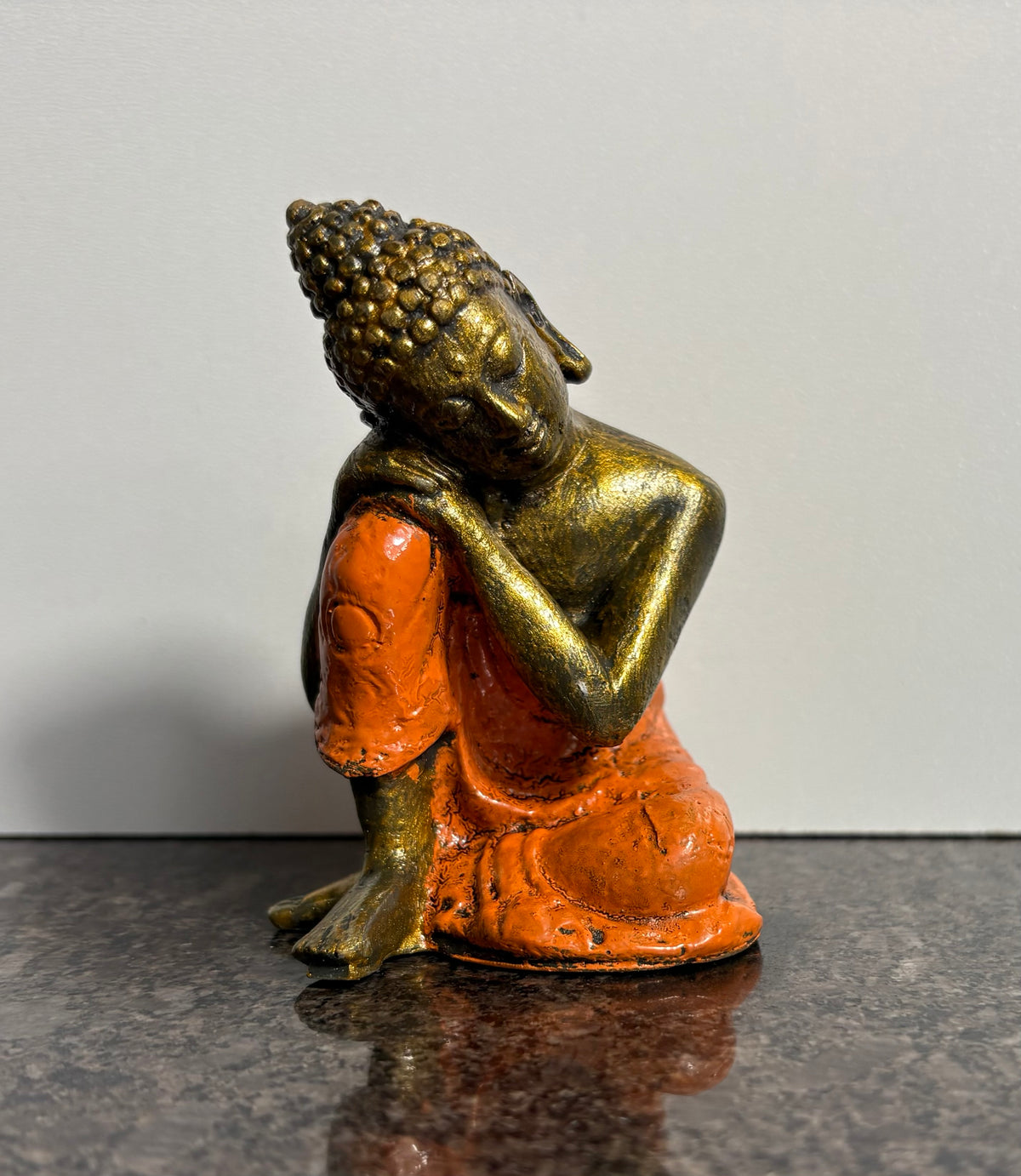 Resting Buddha Resin Figurine – Orange & Gold Meditation Ornament (9cm)