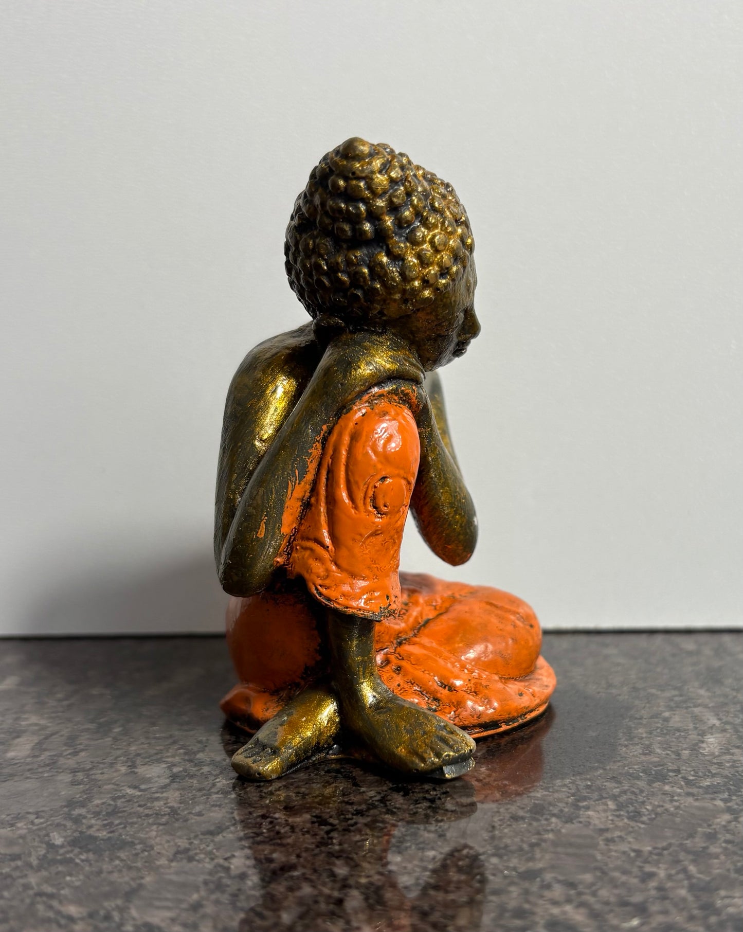 Resting Buddha Resin Figurine – Orange & Gold Meditation Ornament (9cm)