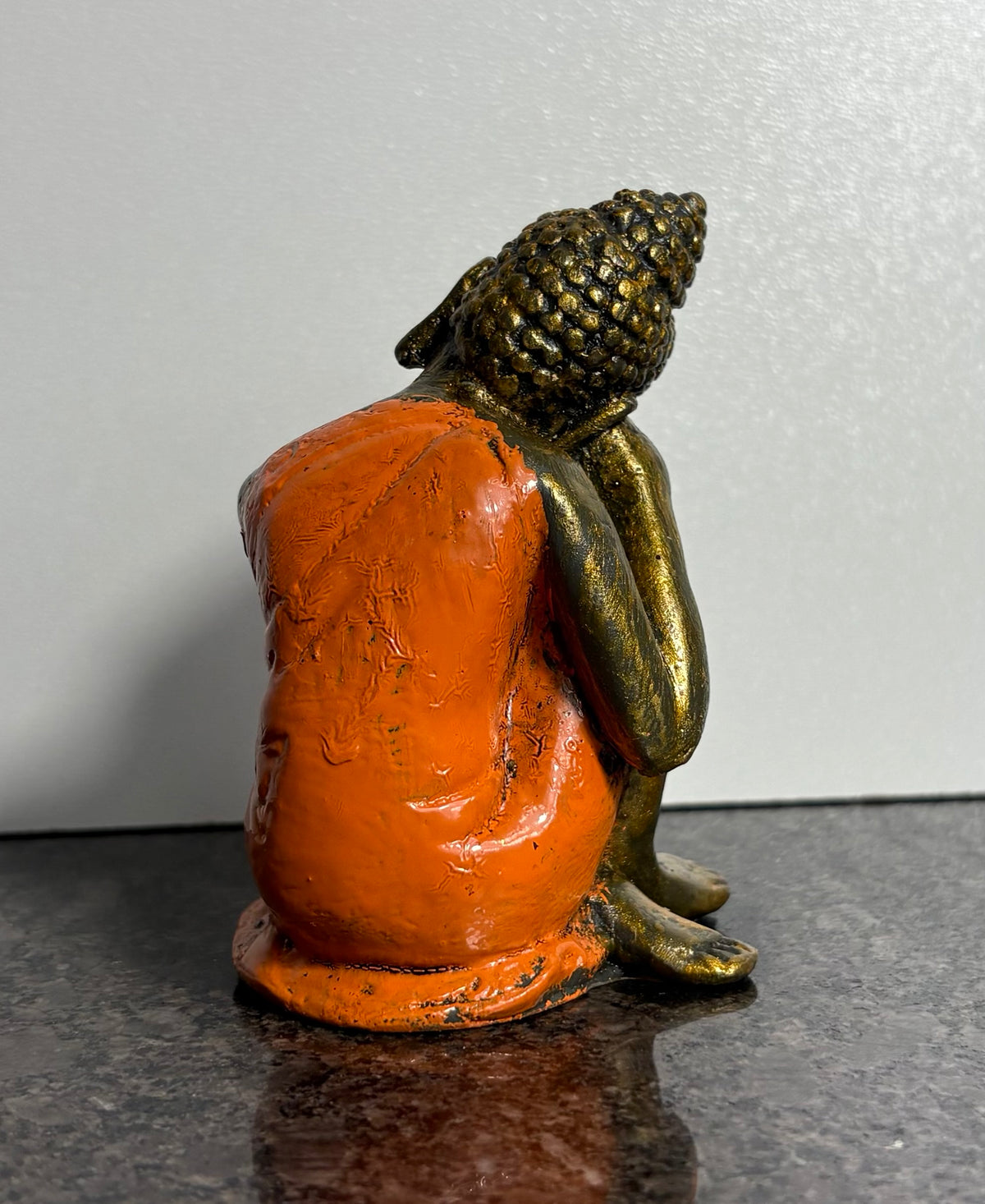 Resting Buddha Resin Figurine – Orange & Gold Meditation Ornament (9cm)