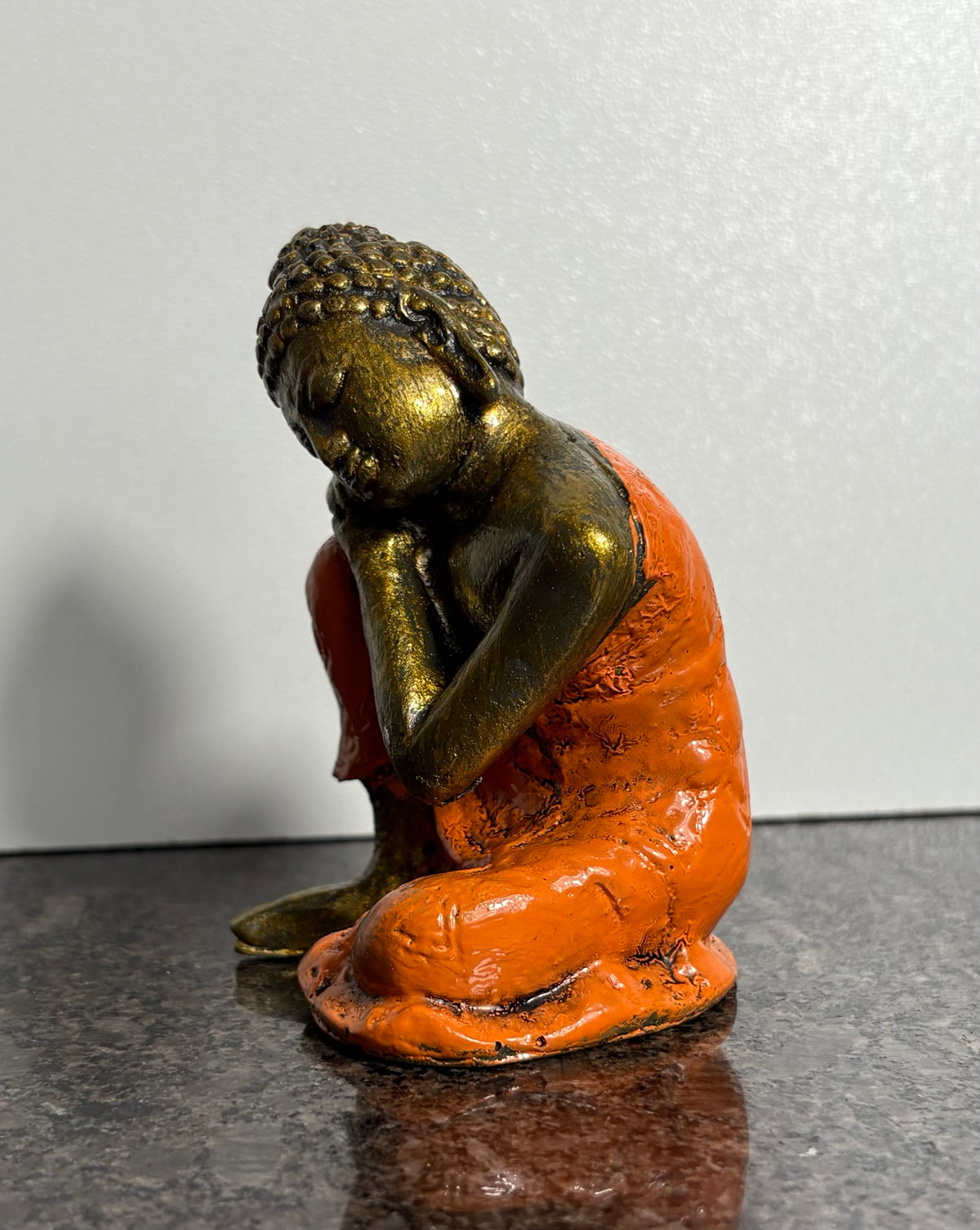 Resting Buddha Resin Figurine – Orange & Gold Meditation Ornament (9cm)