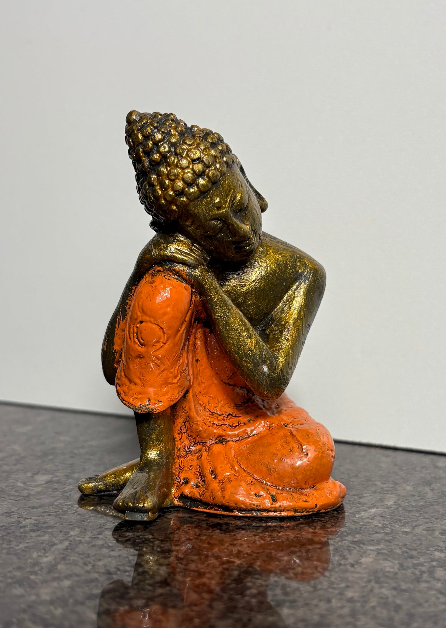 Resting Buddha Resin Figurine – Orange & Gold Meditation Ornament (9cm)